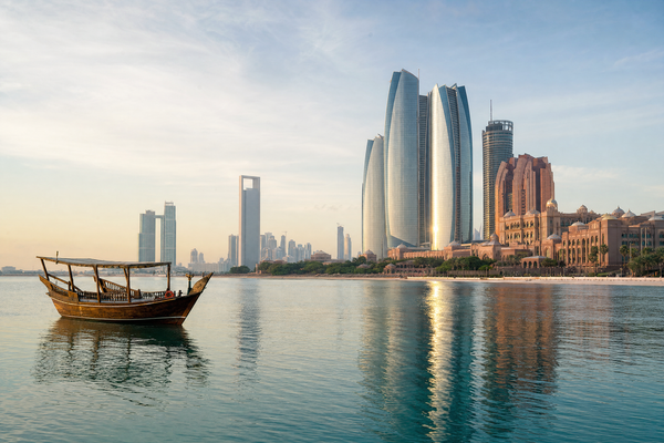 Panoramic view of Abu Dhabi waterfront skyline at dusk