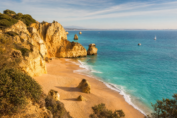 Sunset view over Algarve coastline, Portugal, with cliffs and dreamy beaches