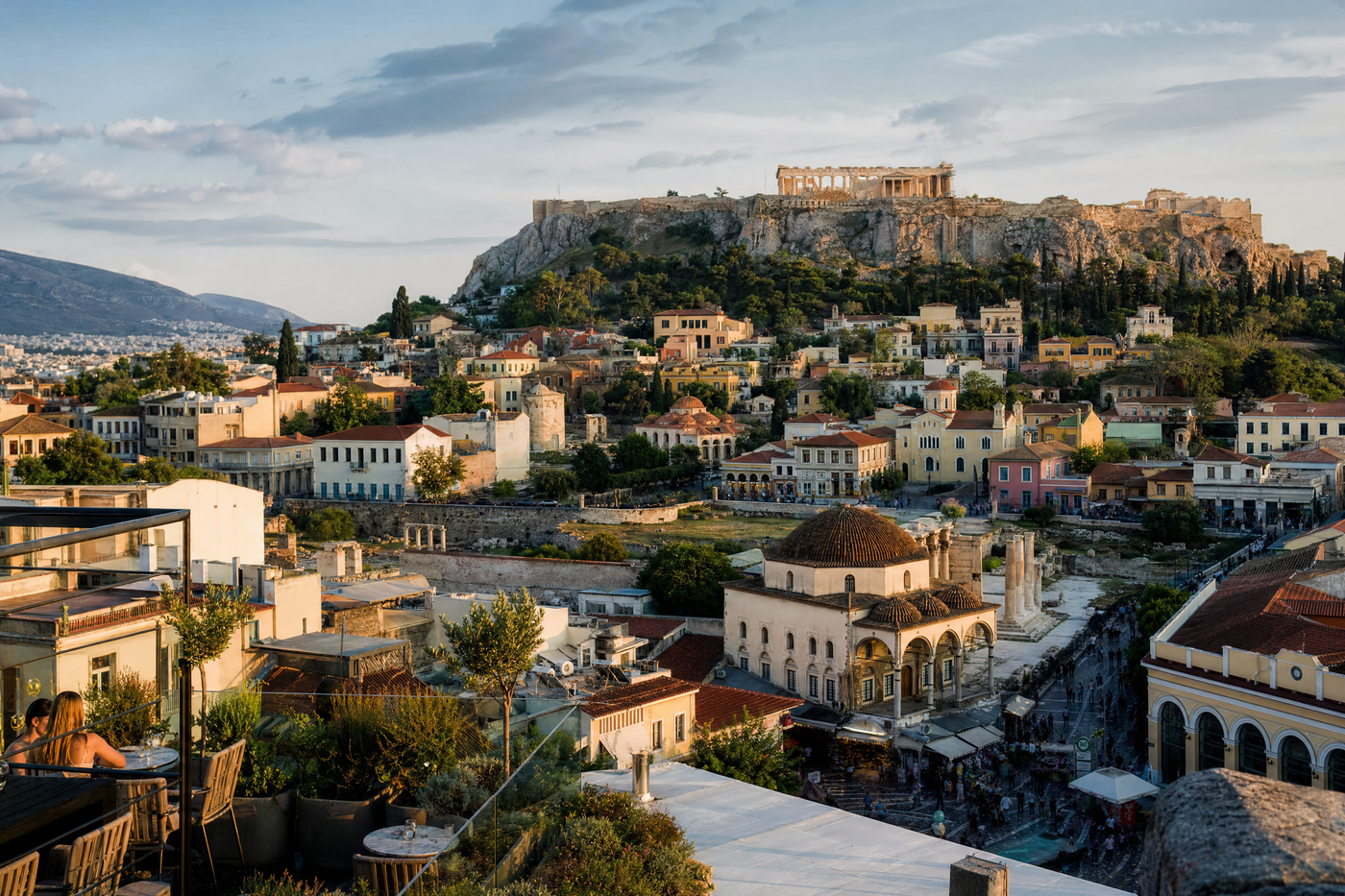 Sunlit view of Athens skyline with the Acropolis in the background