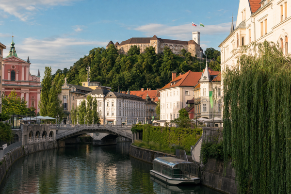 Ljubljana cityscape with river, castle, and seasonal foliage