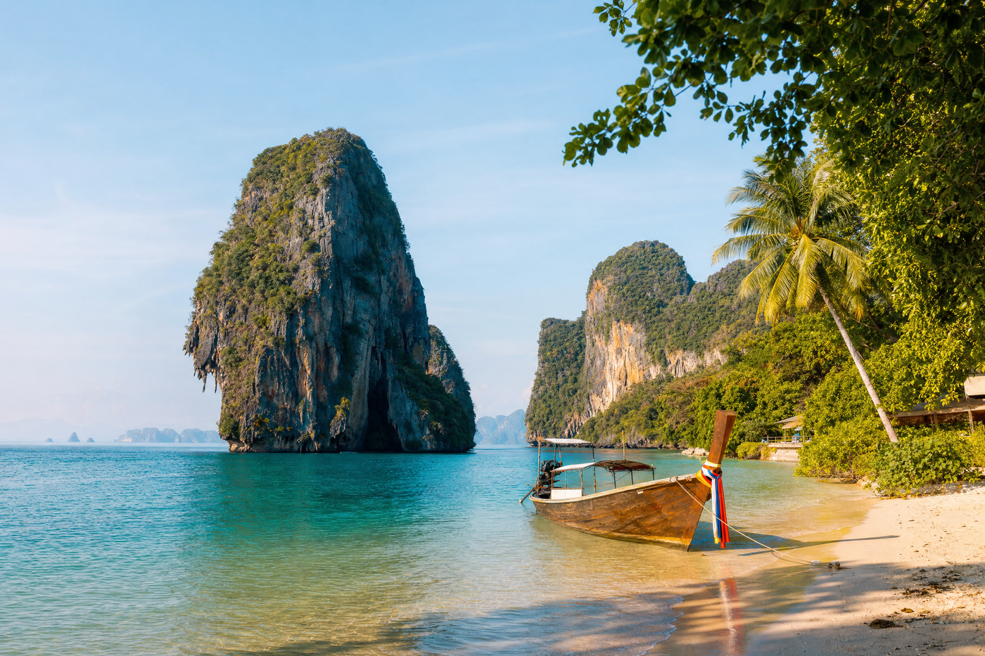 Phuket beach with turquoise water and clear sky, typical of high season