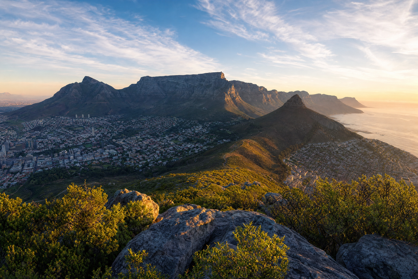 A panoramic view of Cape Town's Table Mountain with the city and coastline below