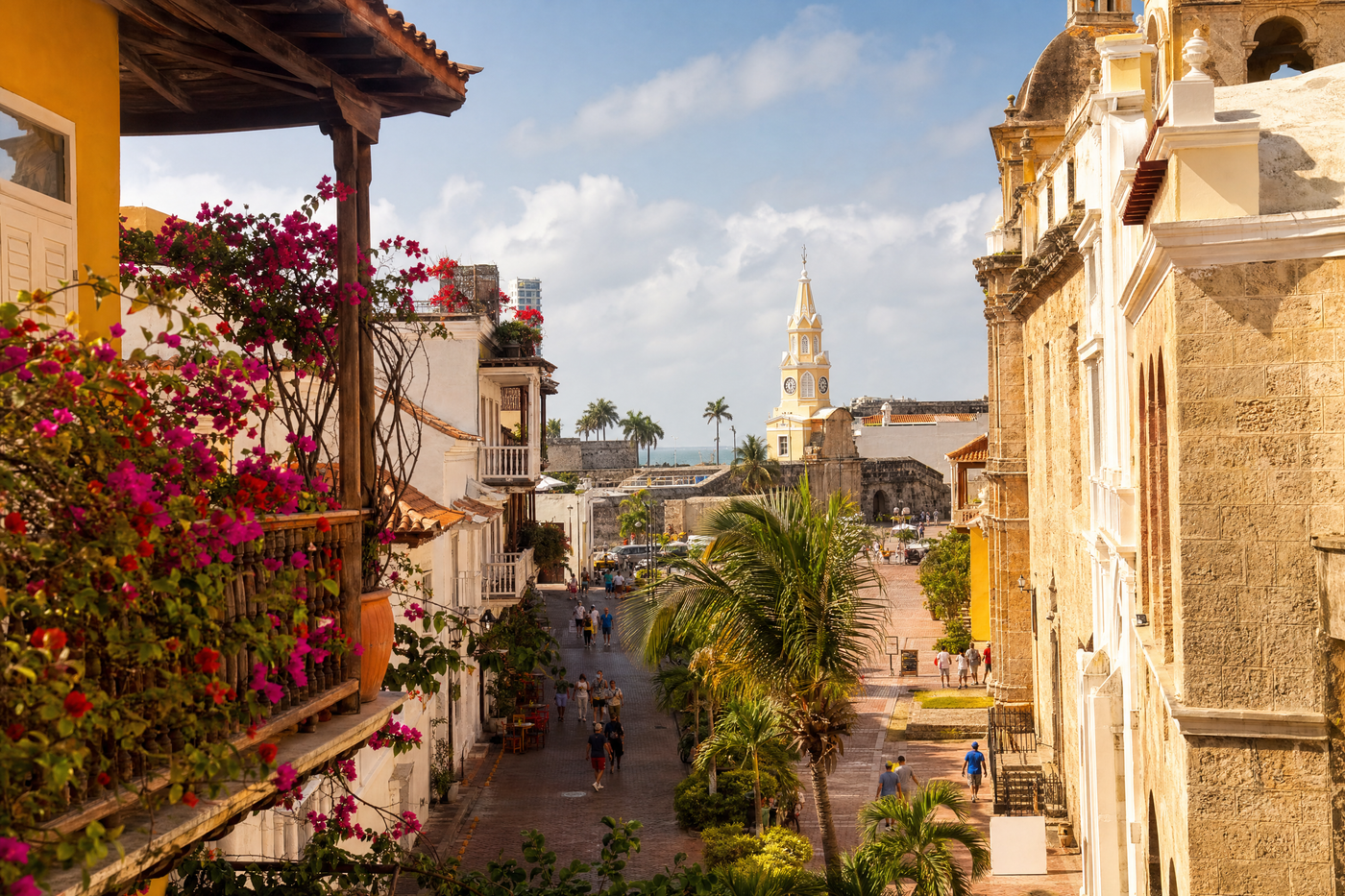 Bright buildings and palm trees along a vibrant Cartagena street