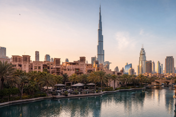 Travelers exploring Dubai's skyline with affordable options