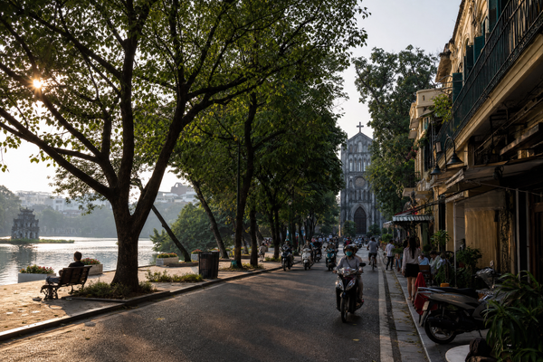 Hanoi's Old Quarter street scene by Hoan Kiem Lake at sunset