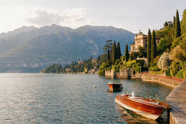 Budget travelers admiring Lake Como from a scenic lakeside path