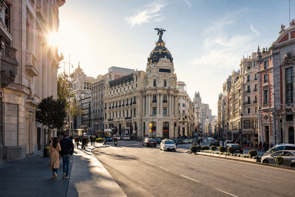 Madrid cityscape with budget travelers exploring iconic attractions