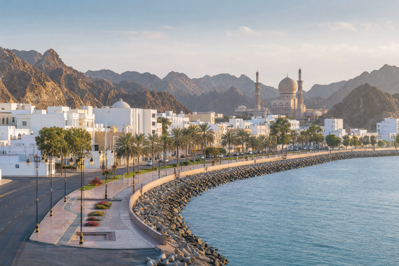 View of Muscat's old town and the mountains at sunset