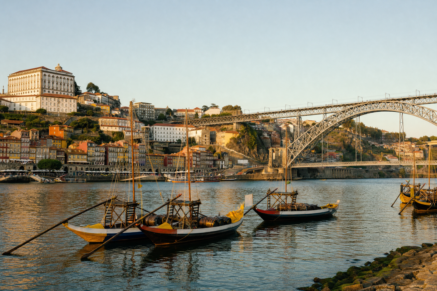 Views of Porto’s historic Ribeira district along the Douro River at sunset.