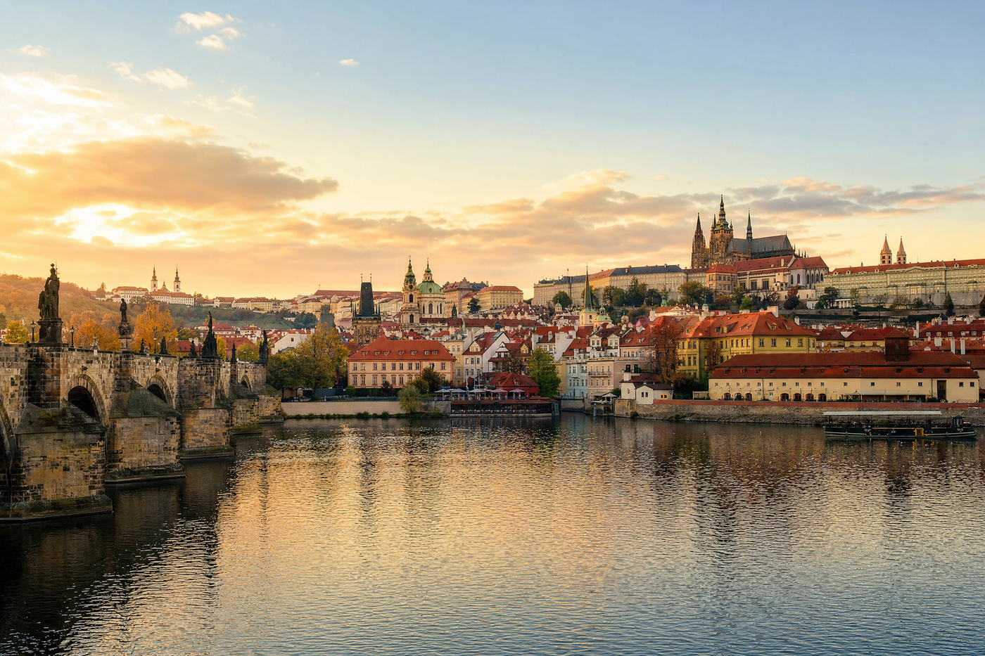 Charles Bridge and Prague skyline at sunset