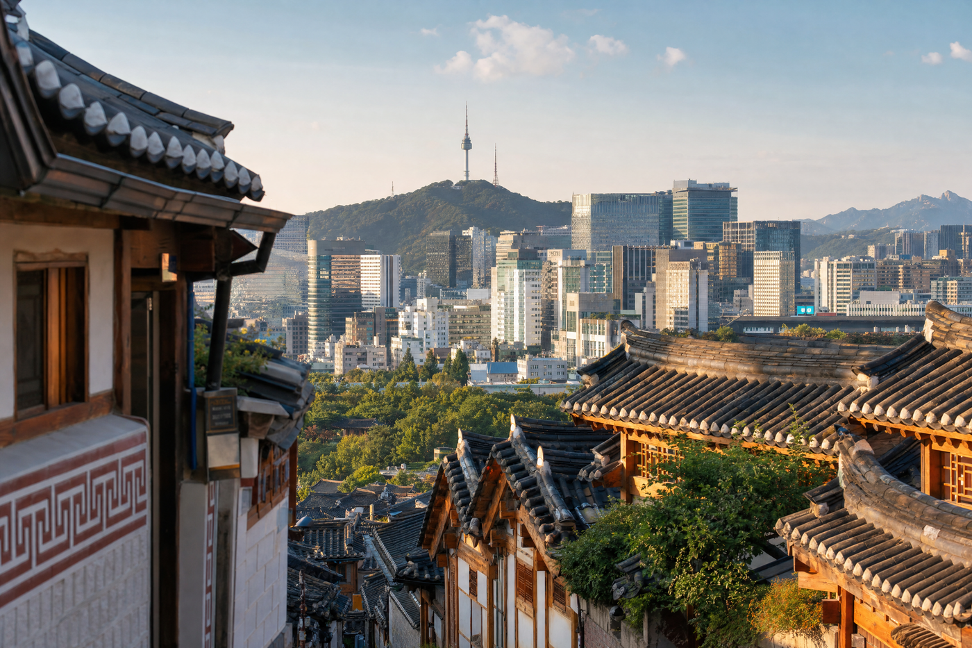 View of Seoul skyline with traditional palace in the foreground and modern cityscape beyond