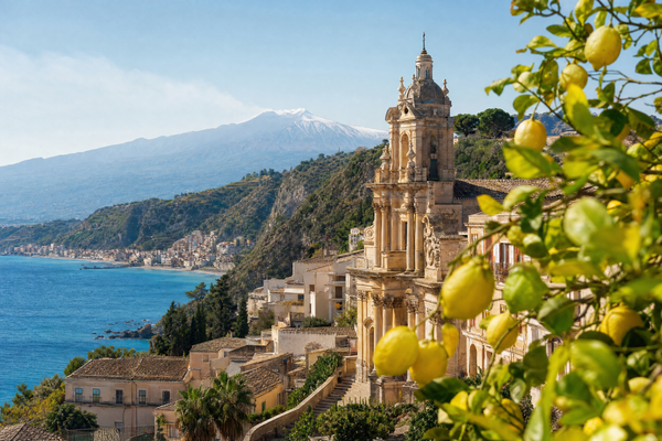 Panoramic view of Taormina with Mount Etna in the background, Sicily, Italy