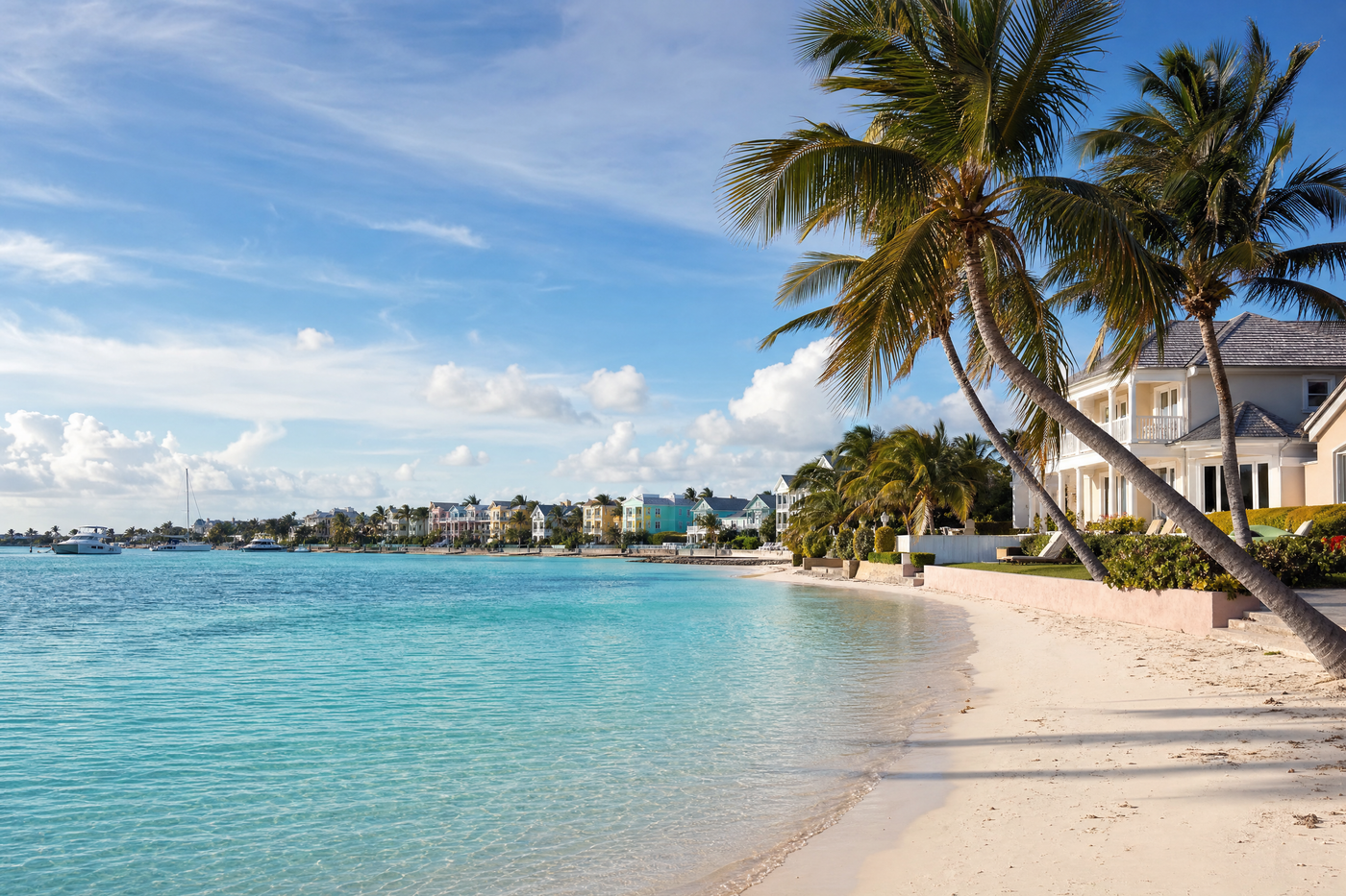 Aerial view of Nassau, Bahamas, showing vibrant neighborhoods and blue waters