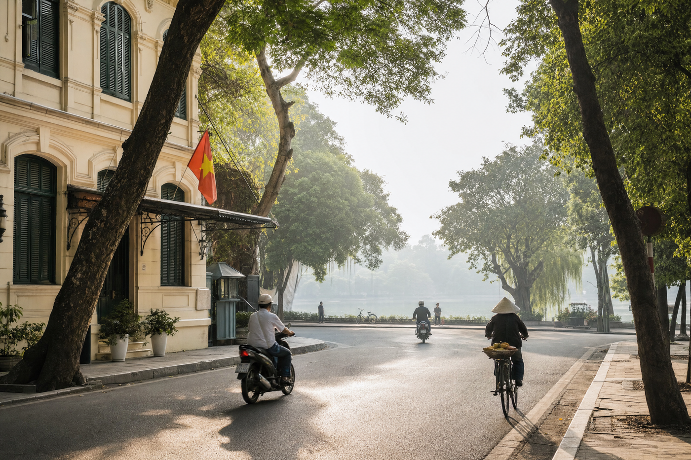 Overlooking Hanoi's Old Quarter rooftops and Hoan Kiem Lake at sunset