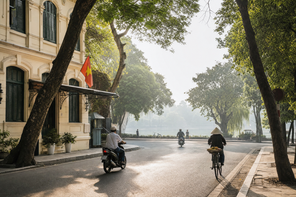 Overlooking Hanoi's Old Quarter rooftops and Hoan Kiem Lake at sunset