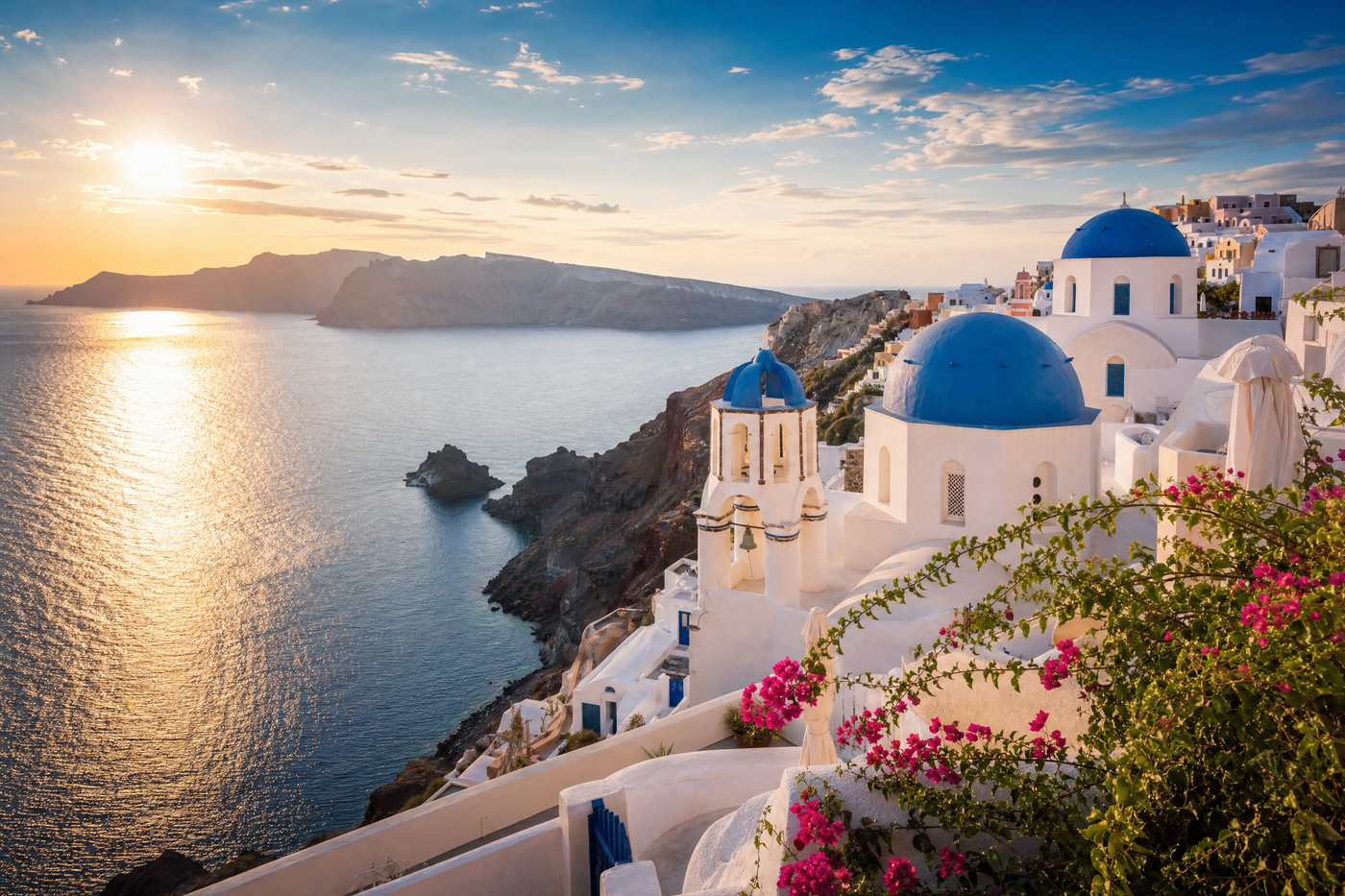 Santorini caldera villages with whitewashed hotels and blue domes