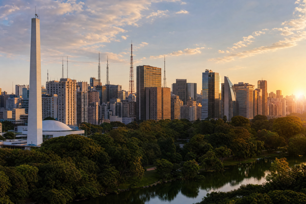 Skyline of São Paulo with diverse neighborhoods during sunset.