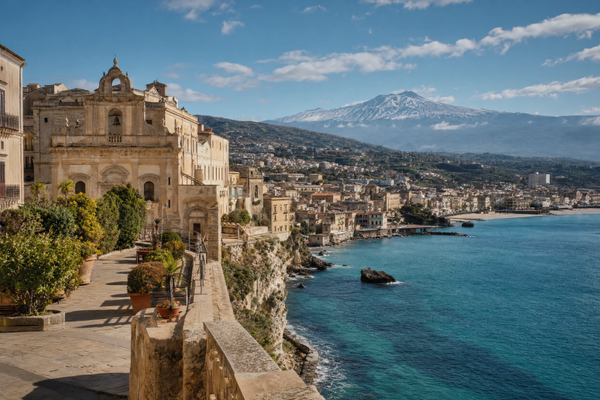 Colorful Sicilian harbor town with hotels, cafes and blue seaside